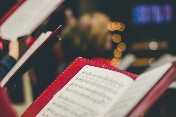 sheet music in red folder